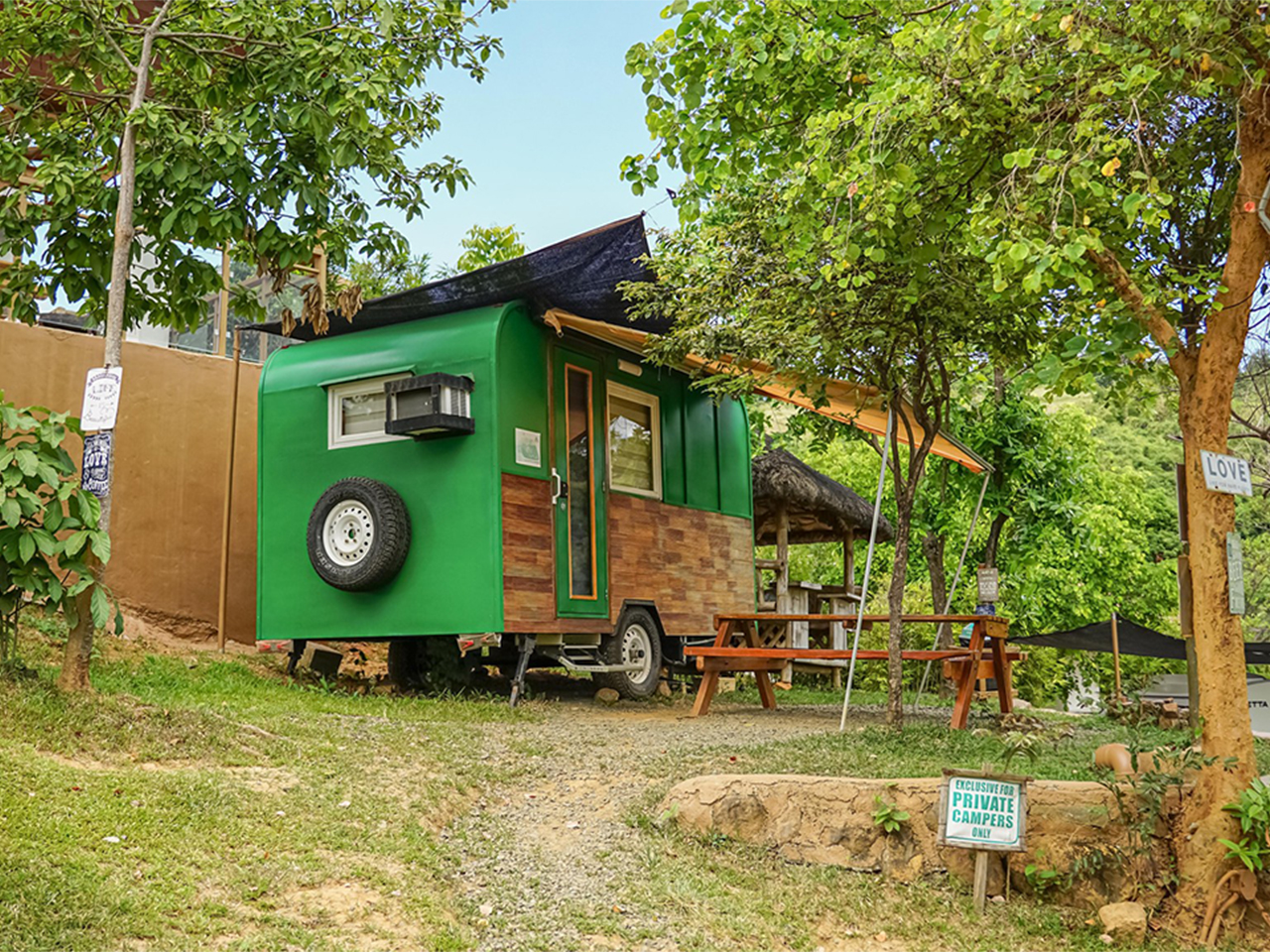 Warmly lit camper trailer prepared for an overnight stay
