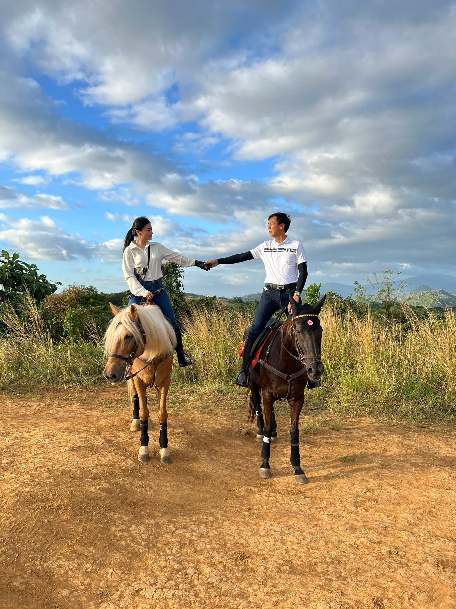 Rider on horseback travelling through a scenic mountain landscape