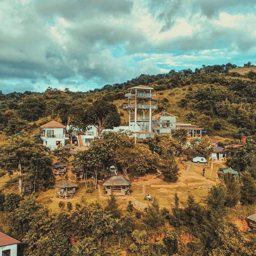 Elevated overview of UCM Adventure Park and its observation tower