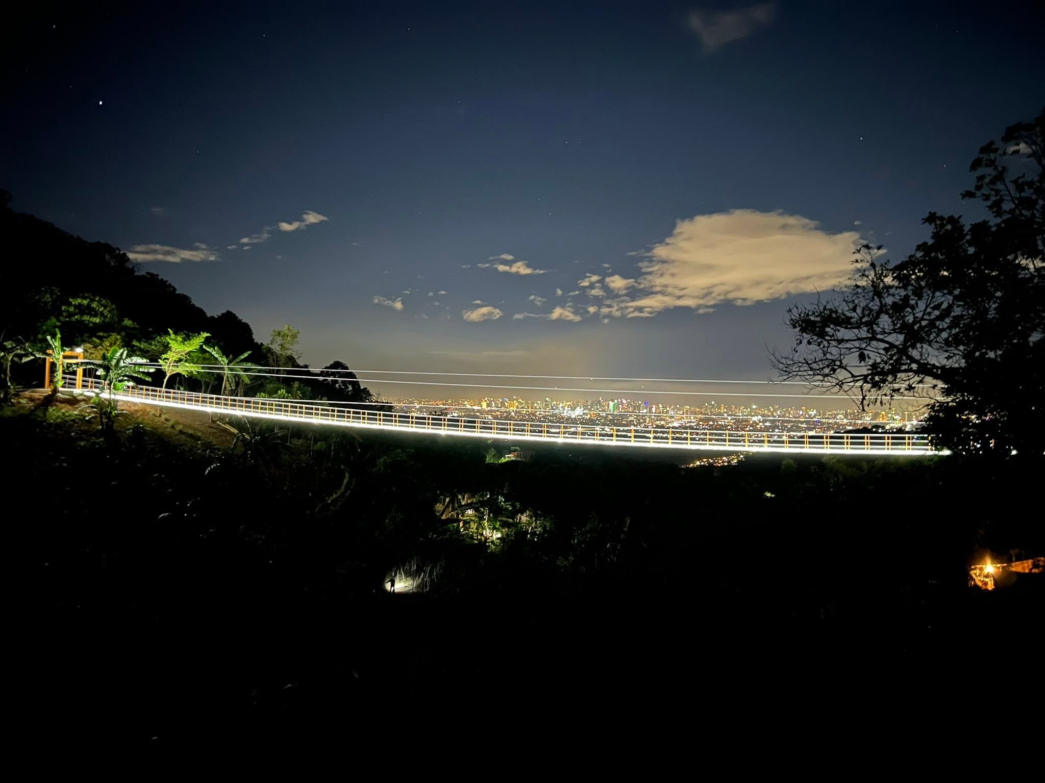 Illuminated viewpoint overlooking the city at night